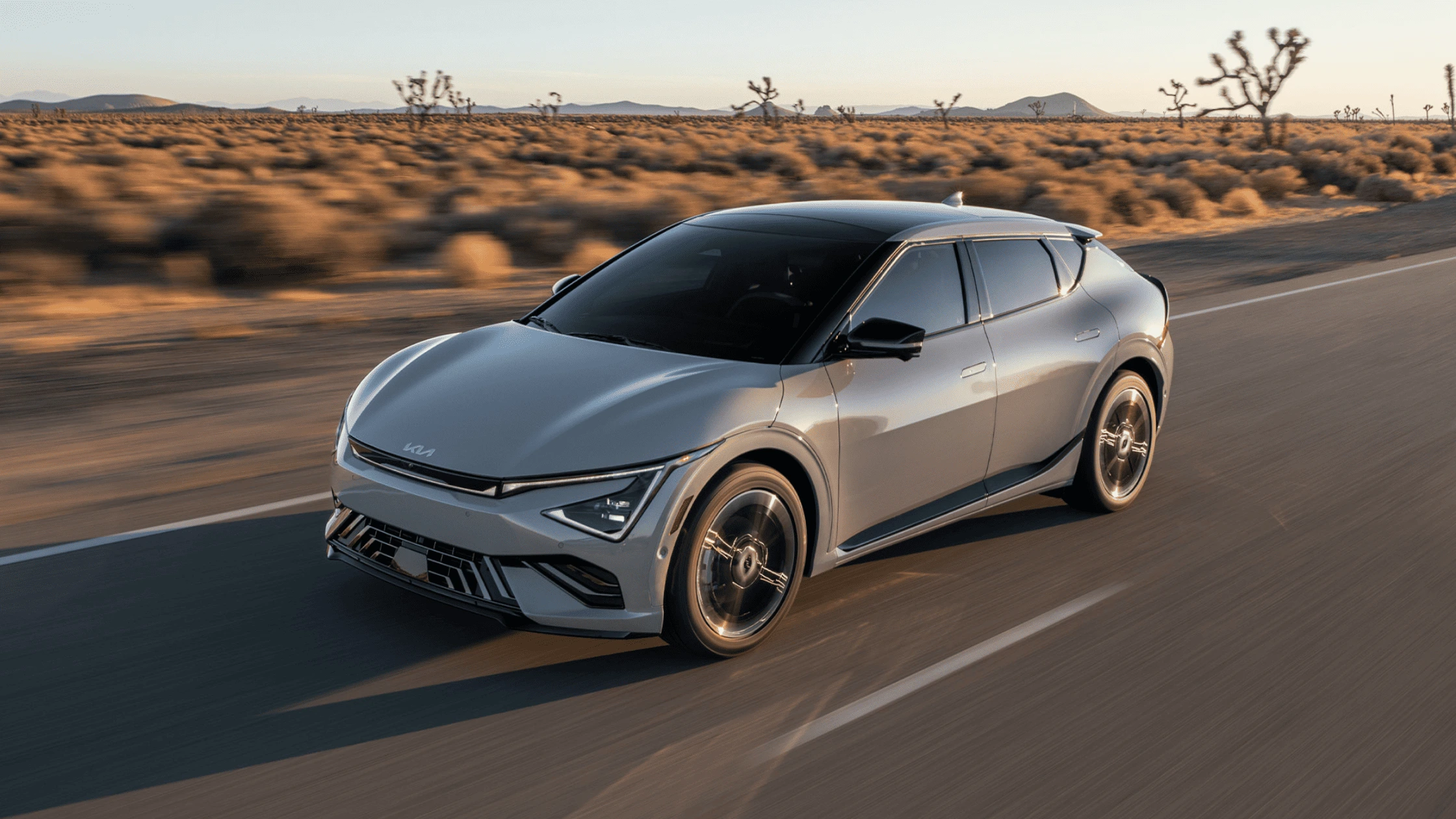 2025 Kia EV6 driving on an open highway in Fort Myers, FL, showcasing its sleek aerodynamic design and electric performance.