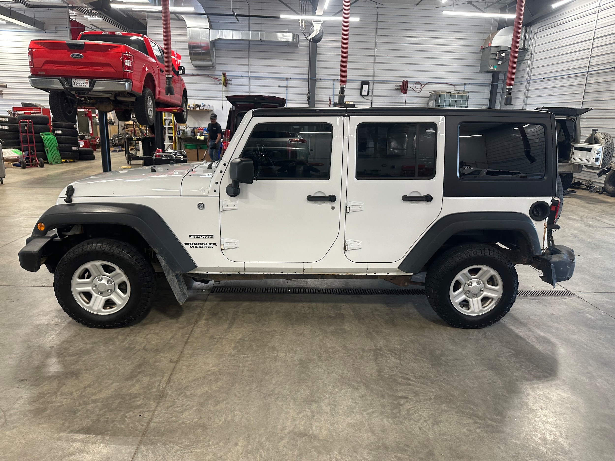 Used 2014 Jeep Wrangler Unlimited Sport with VIN 1C4BJWKG6EL328273 for sale in Galena, IL