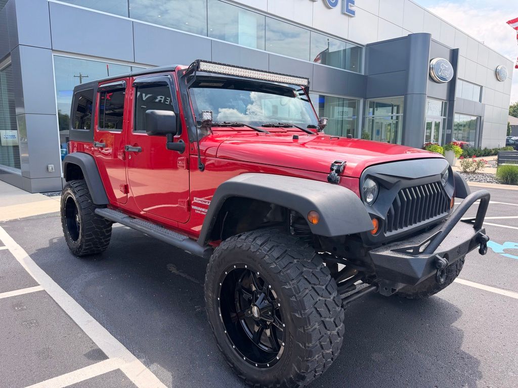 Used 2012 Jeep Wrangler Unlimited Sport with VIN 1C4BJWDG9CL199584 for sale in Galesburg, MI