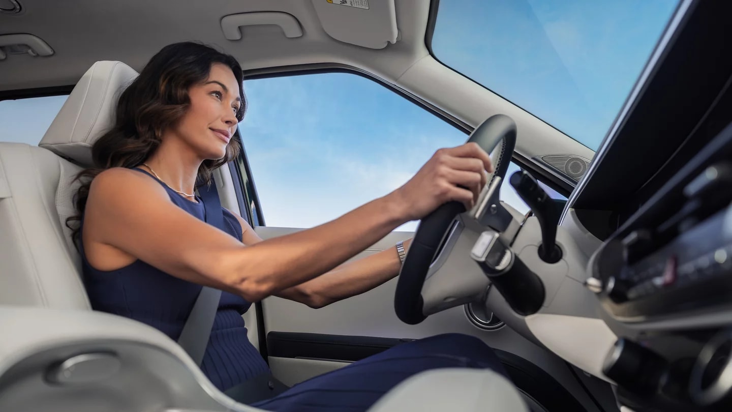 woman driving a 2026 Hyundai Palisade