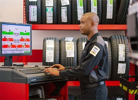 tire technician at computer