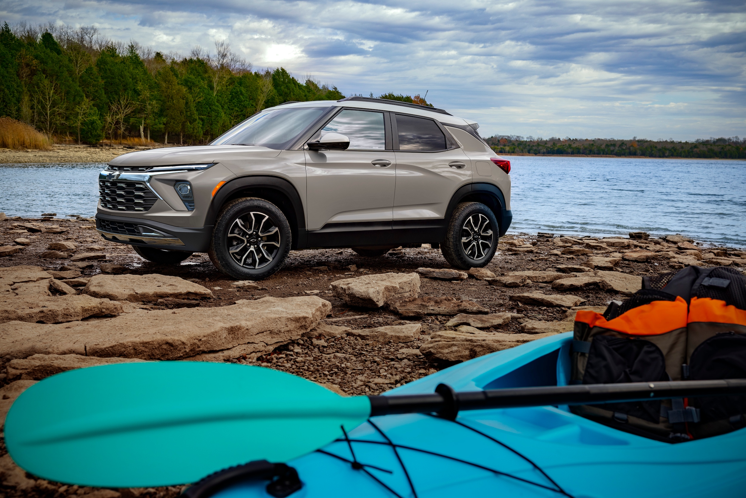 2026 Chevy Trailblazer ACTIV on sand next to kayaks.