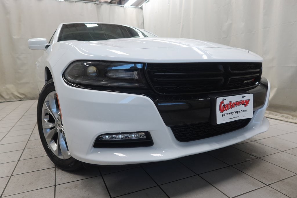 Used 2021 Dodge Charger SXT with VIN 2C3CDXJGXMH575752 for sale in Fargo, ND