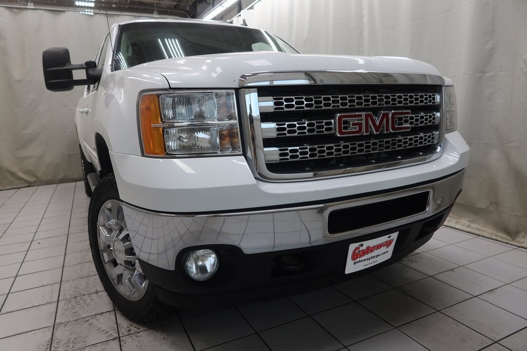 Used 2013 GMC Sierra 2500HD SLT with VIN 1GT121E85DF186379 for sale in Fargo, ND