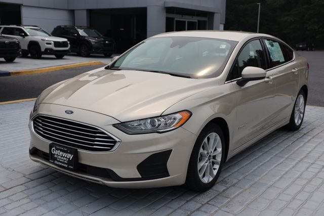 White Gold Metallic 2019 Ford Fusion Hybrid Sedan Front-Wheel Drive Continuously Variable Transmission