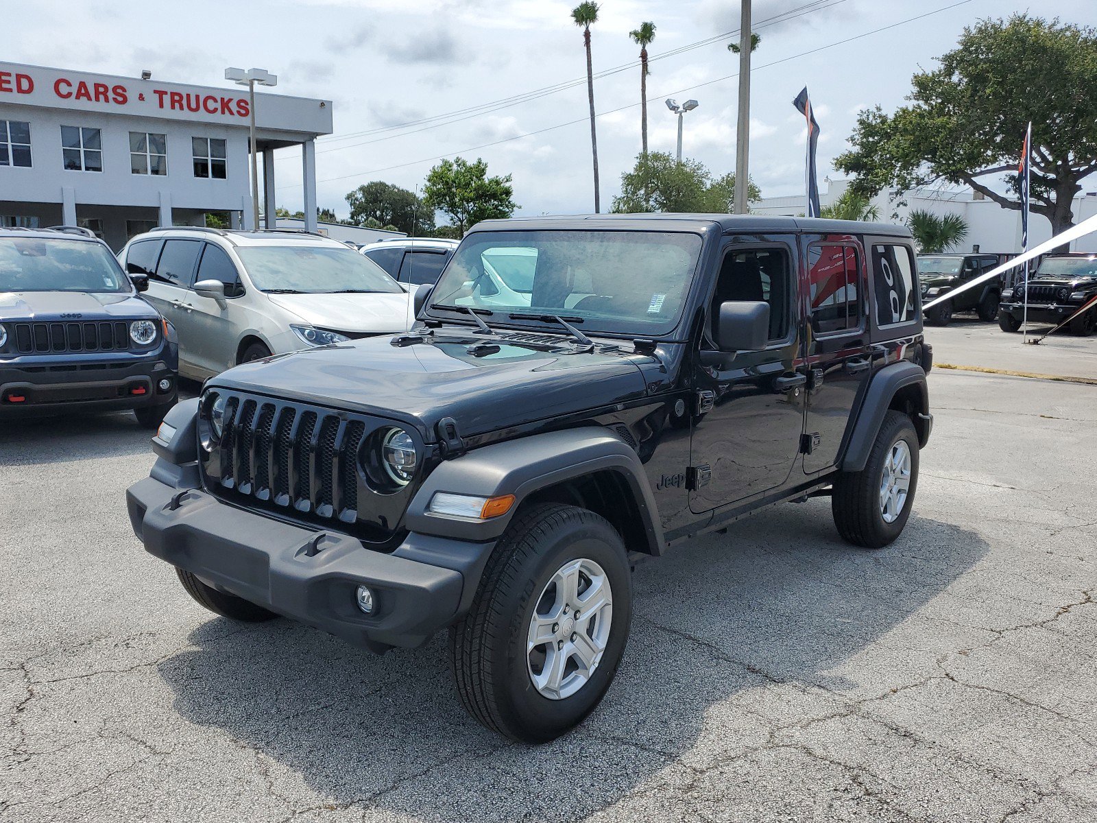 Used 2023 Jeep Wrangler 4-Door Sport with VIN 1C4HJXDG9PW500052 for sale in Melbourne, FL