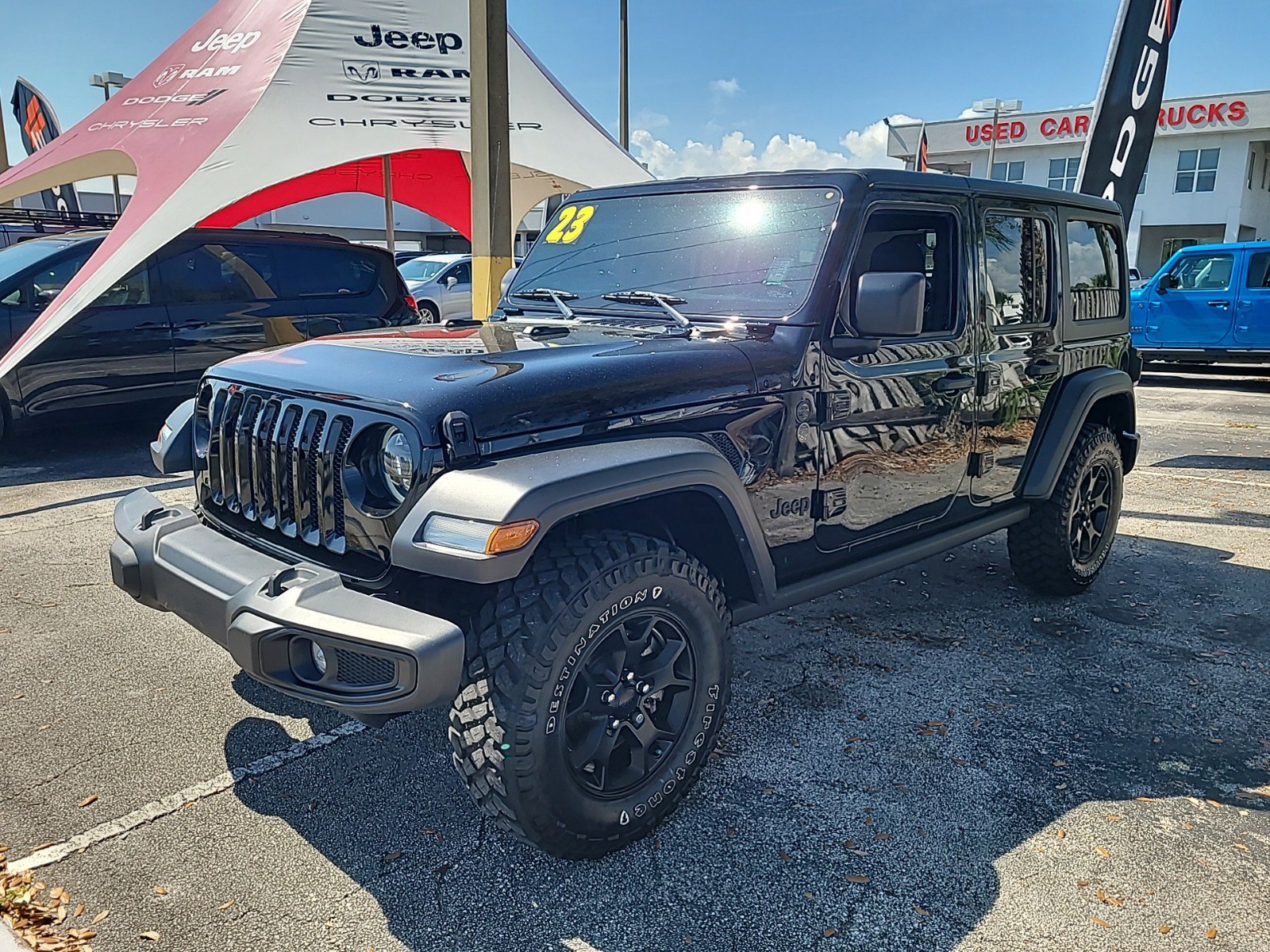 Used 2023 Jeep Wrangler 4-Door Willys with VIN 1C4HJXDN7PW500369 for sale in Melbourne, FL