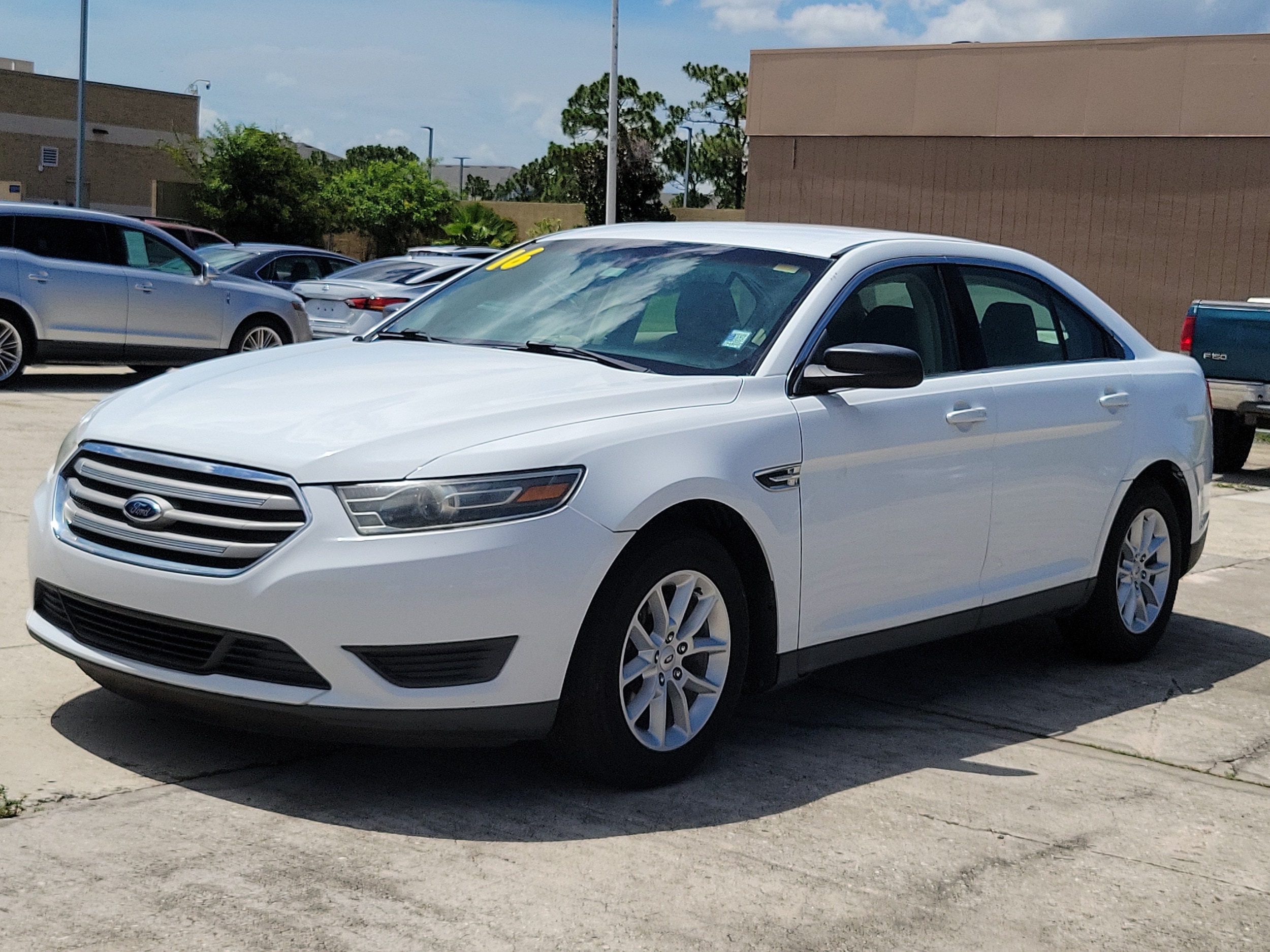 Used 2015 Ford Taurus SE with VIN 1FAHP2D8XFG106598 for sale in Melbourne, FL