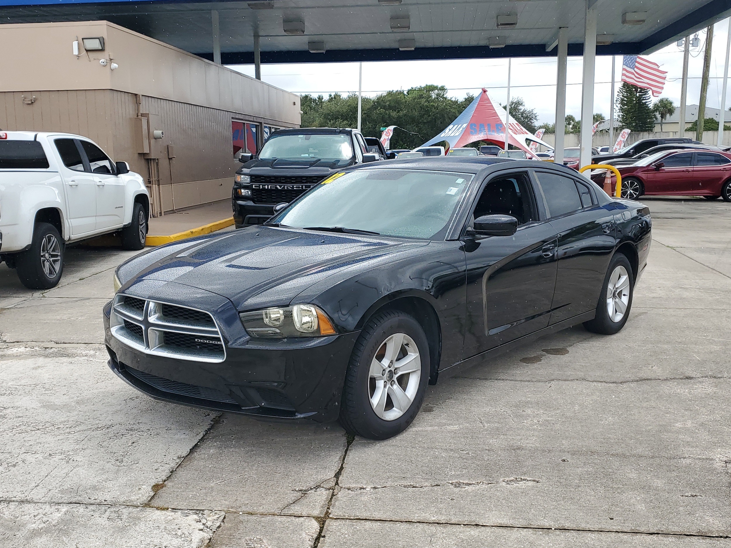 Used 2012 Dodge Charger SE with VIN 2C3CDXBG4CH125673 for sale in Melbourne, FL