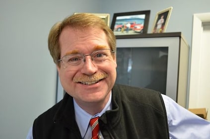 Staff member John Langley from 5de1dda7c0c1