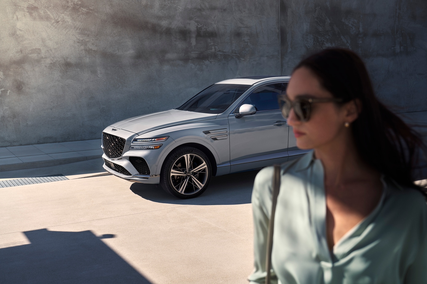  Woman with 2026 Genesis GV80