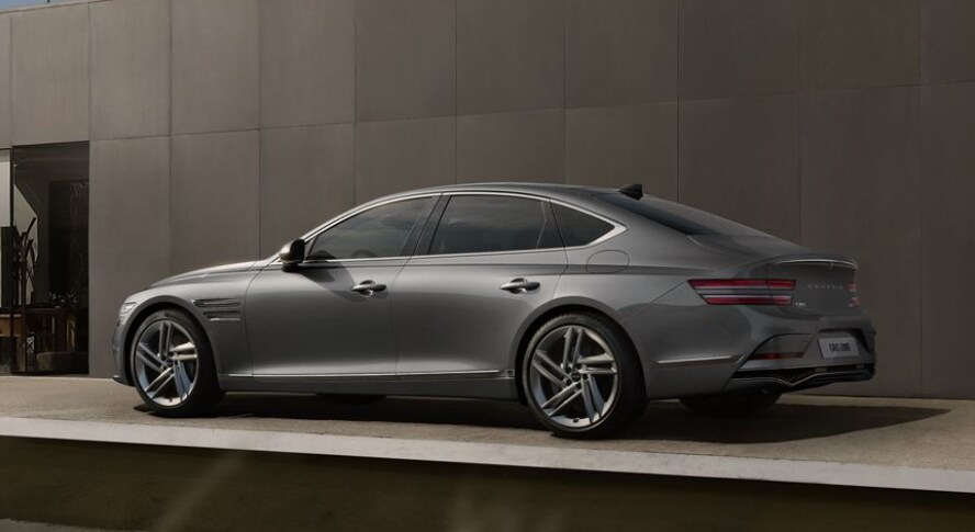 Genesis G80 parked outside of modern building