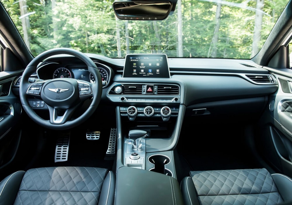 Interior design view of the 2020 Genesis G70 luxury sedan showing quilted leather seats and innovative interior technology