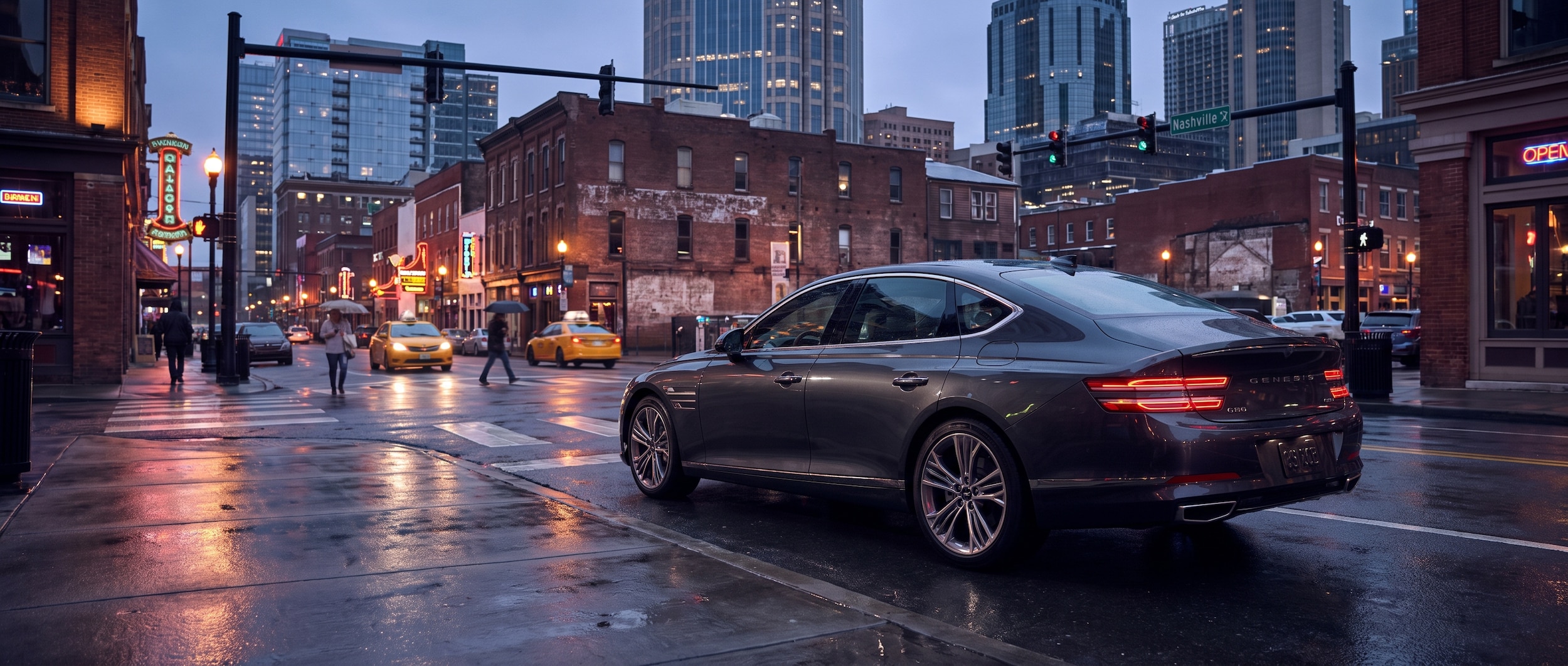 2026 Genesis G80 on a wet Nashville street at dusk with the city skyline in the background