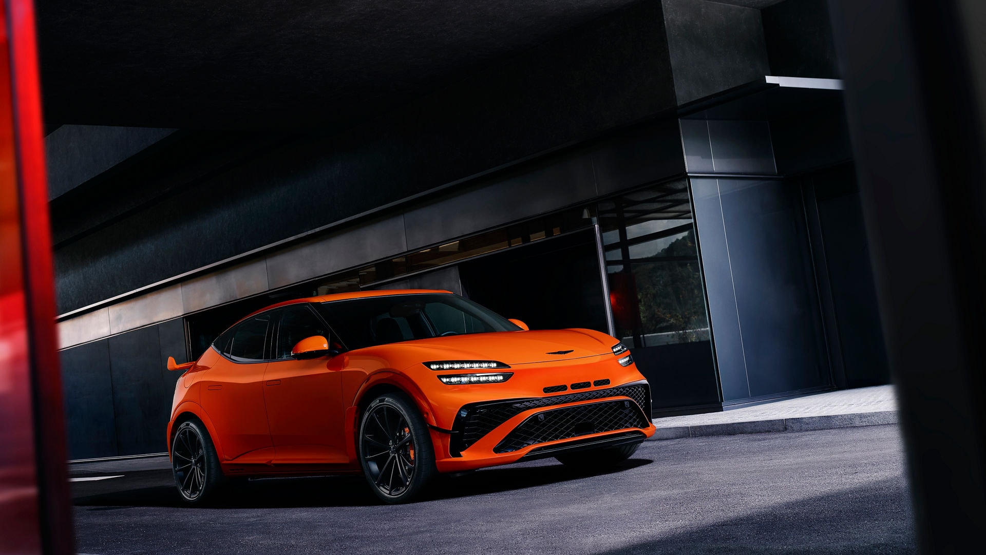 2027 Genesis GV60 Magma on the road