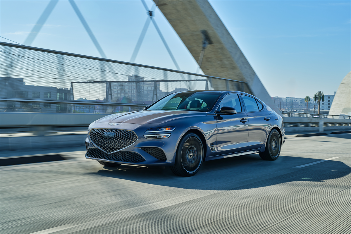 The 2026 Genesis G70 driving in the city