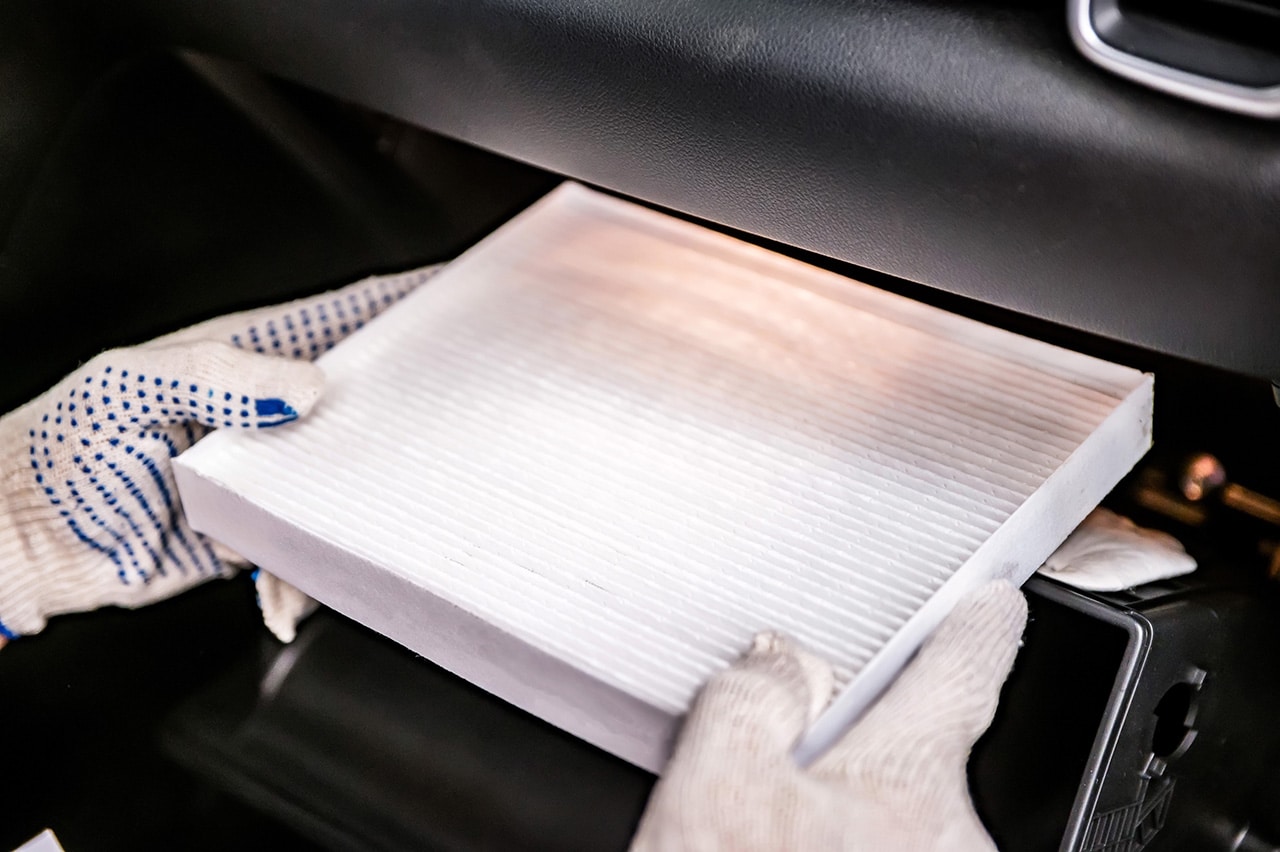 Technician working on air filter replacement