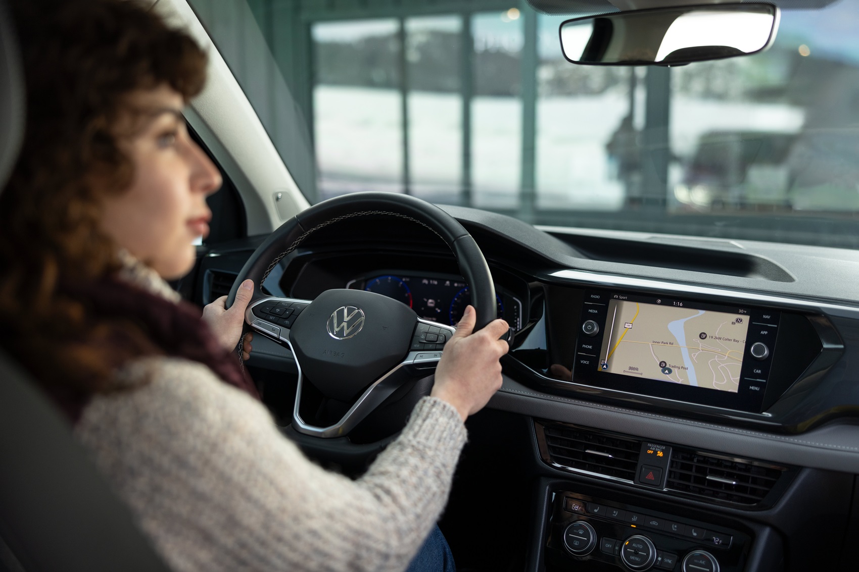 Inside look at the dashboard of the Volkswagen Taos with women behind the wheel from Volkswagen Dealer near Bloomfield NJ