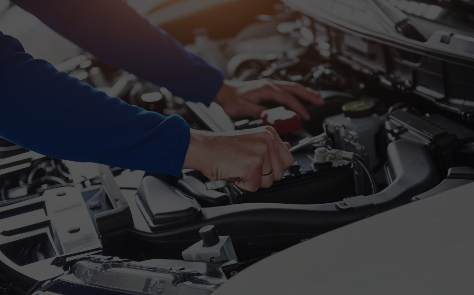 Technician Under Vehicle Hood