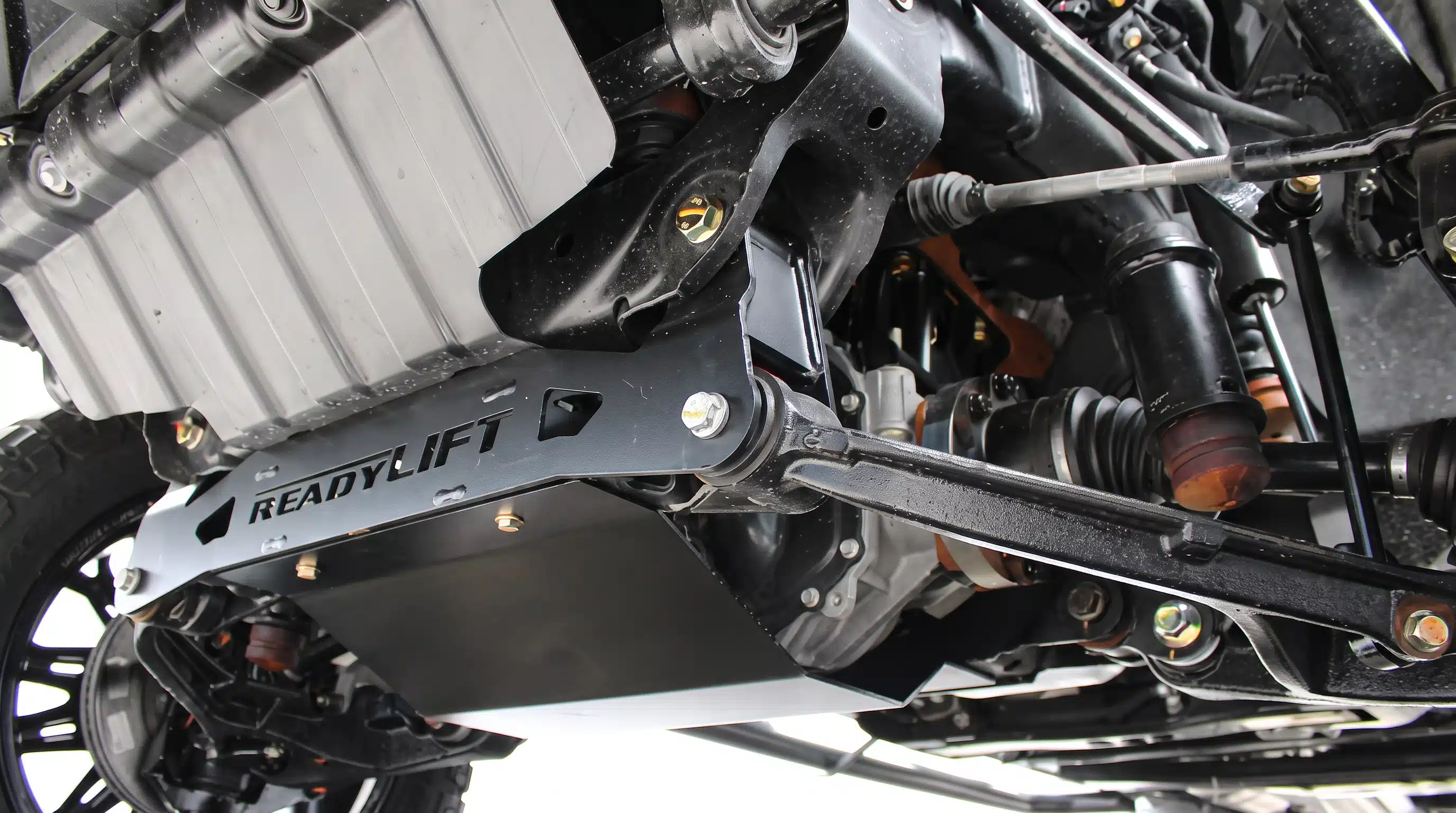 Lifted Chevy Silverado in the Gibson Truck World service department in Sanford, FL