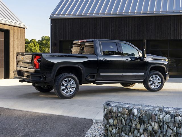 Black Chevy Silverado 2500, parked in driveway