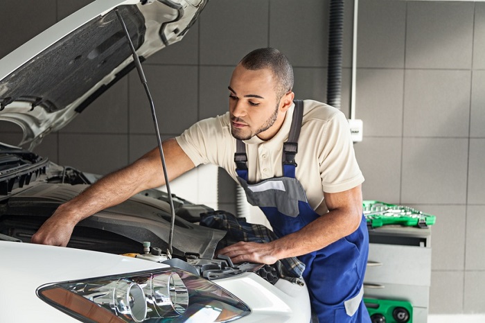 Mechanic_Working_On_Front_Of_Car.jpg