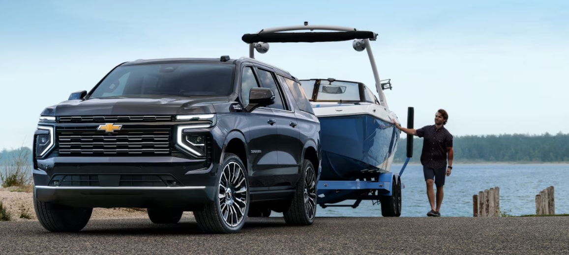 2025 Chevrolet Suburban towing a boat