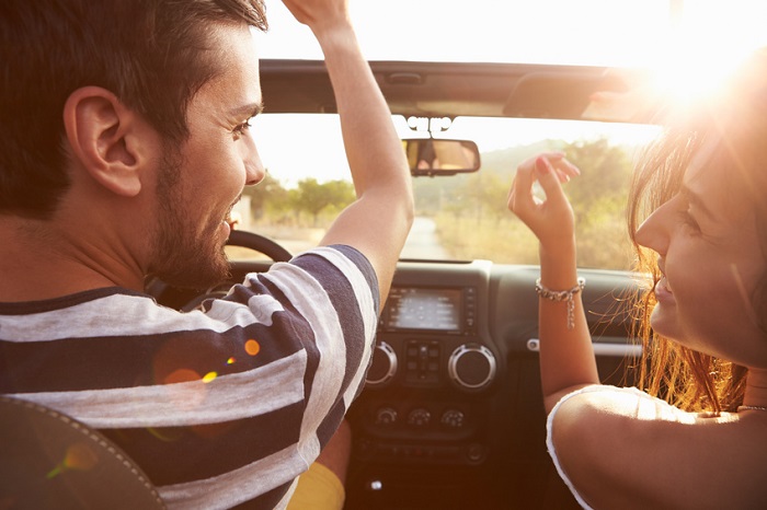 Couple_Driving_On_Road.jpg
