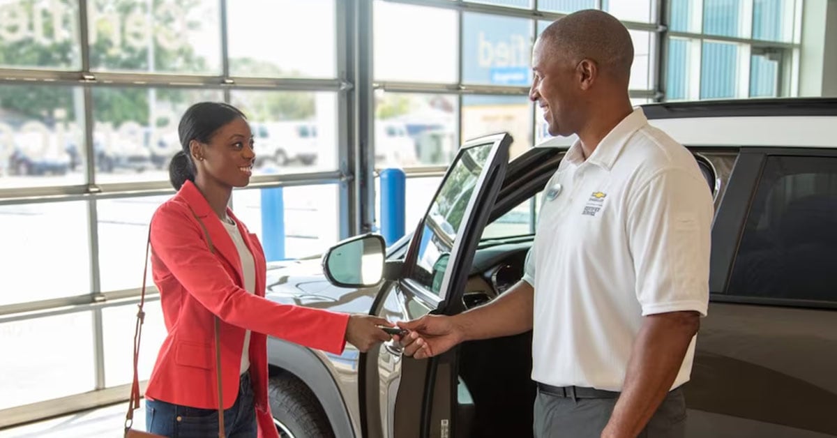 Dealership - Customer shaking hands with Salesperson