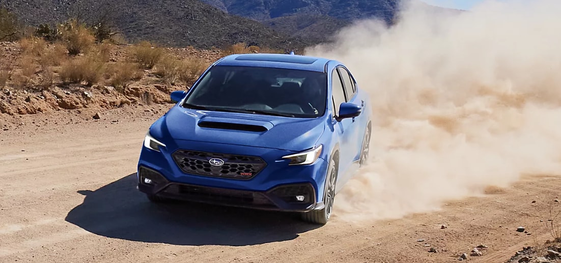 2025 Subaru WRX drifting on dirt road