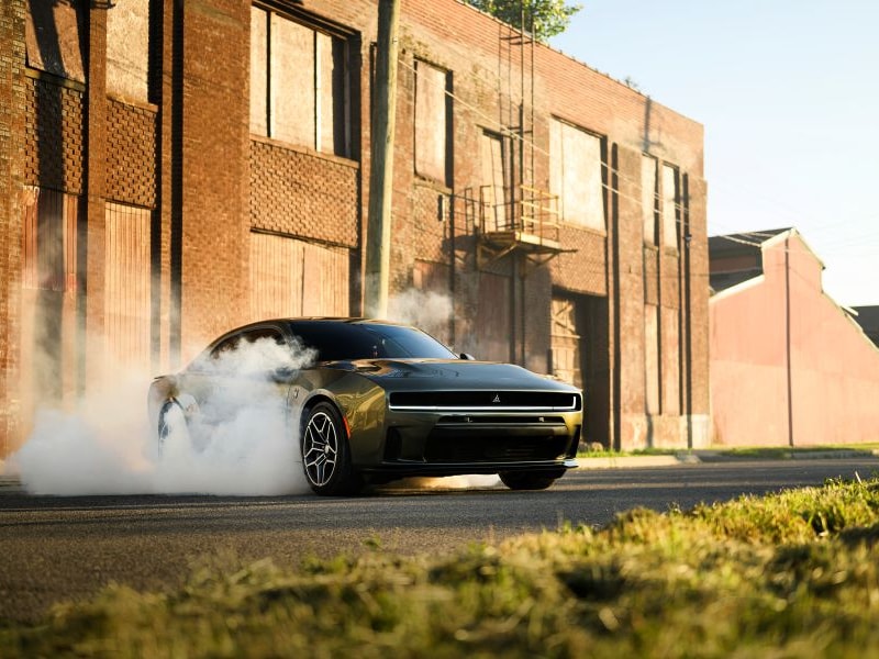 Dodge Charger doing donuts in a parking lot from Dodge Dealer near Me
