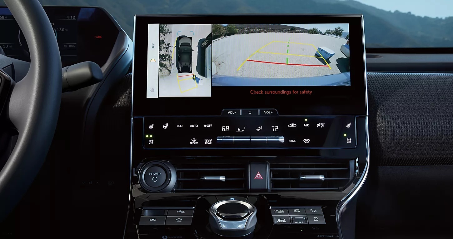 Dashboard screen showing background camera and safety features.