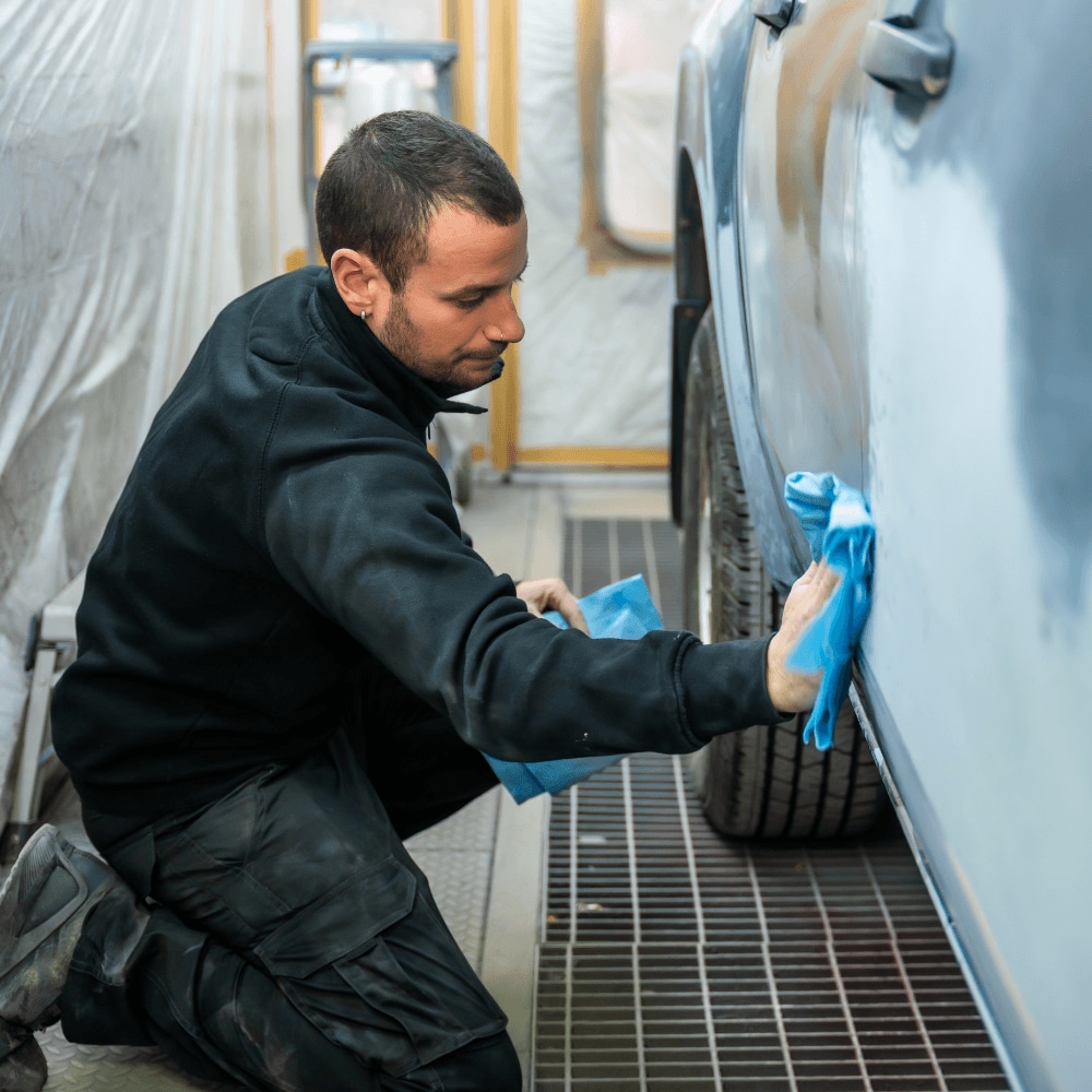 a man repairing a vehicle