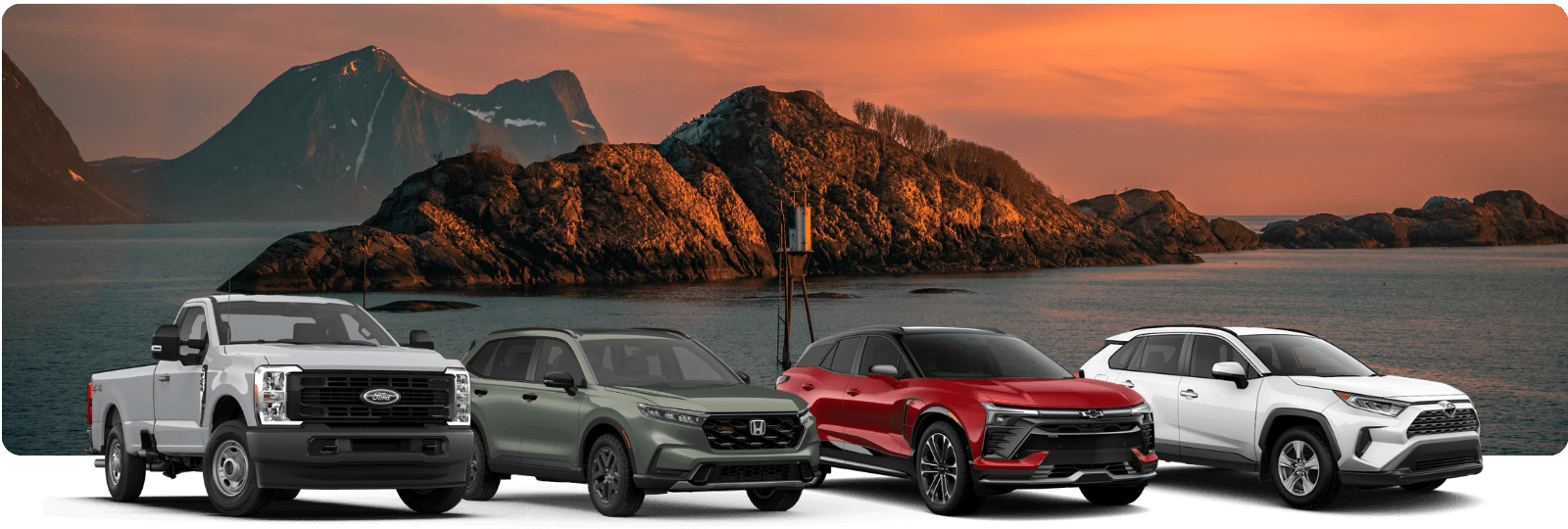 vehicles lined up with a scenic background