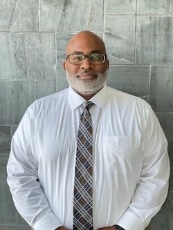 Staff member Andre Roach from ID_28a1f5598194