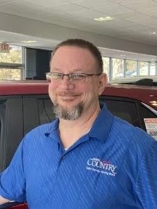 Staff member John Young from ID_f59219
