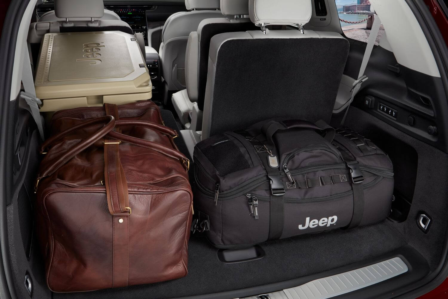 Jeep Grand Cherokee interior with seats folded down and luggage stored