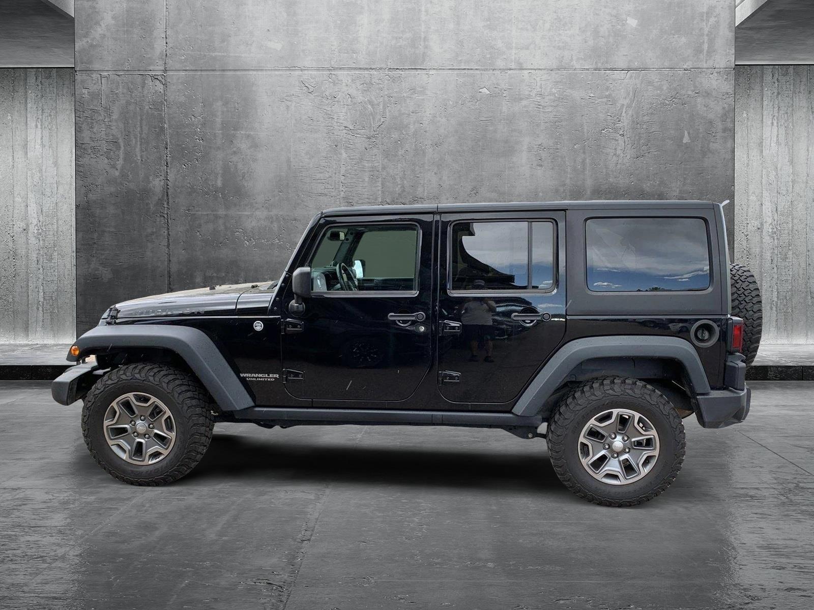 Used 2014 Jeep Wrangler Unlimited Rubicon with VIN 1C4BJWFG1EL158480 for sale in Littleton, CO