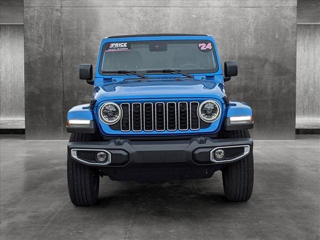 Used 2024 Jeep Wrangler 4-Door Sahara with VIN 1C4PJXEG6RW261136 for sale in Golden, CO