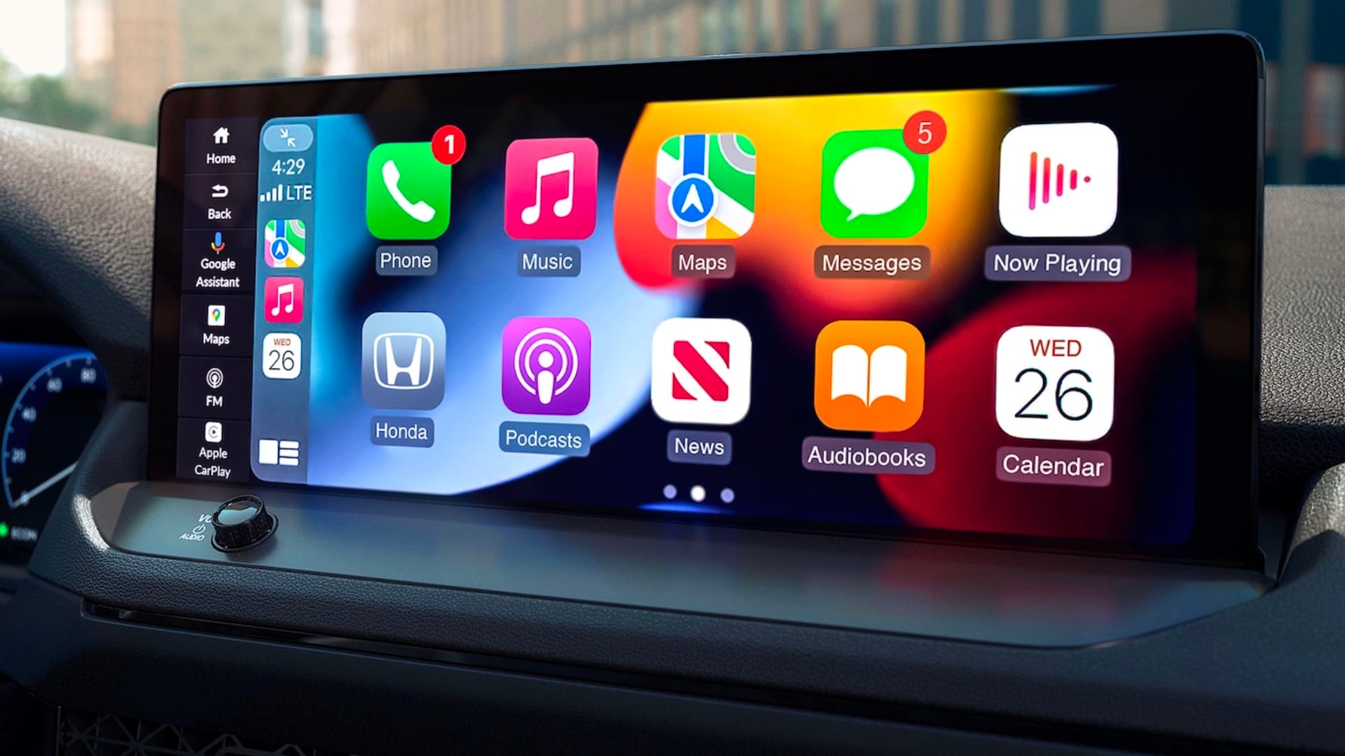 Interior of a Honda with frame focused on touch screen displaying Apple CarPlay UI