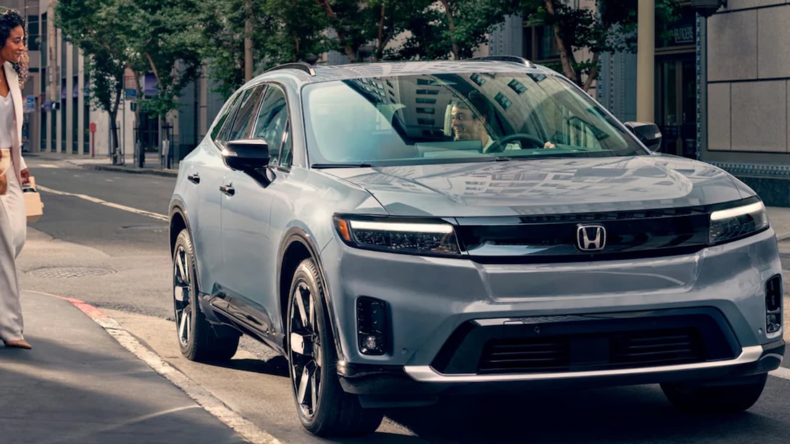 A Honda Prologue driver stopping to talk to someone on the street