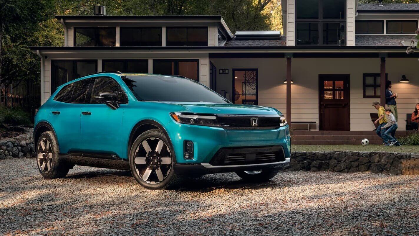 A Honda Prologue sitting outside a house