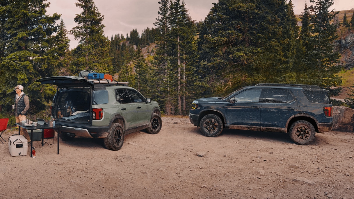 Two Honda Passport in Ash Green Metallic & Smoke Blue Pearl parked at campsite