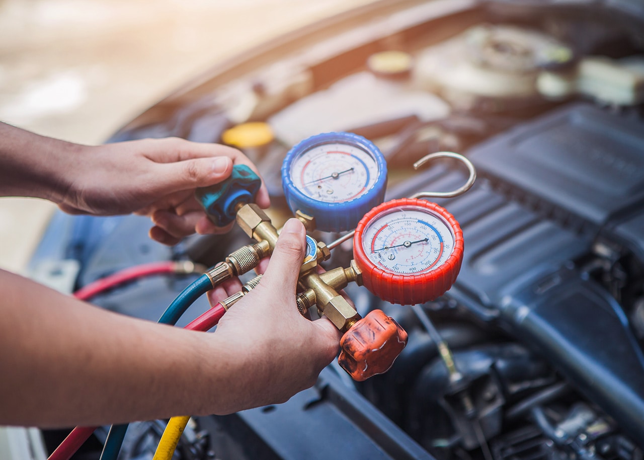 Testing A/C system at an Acura service center