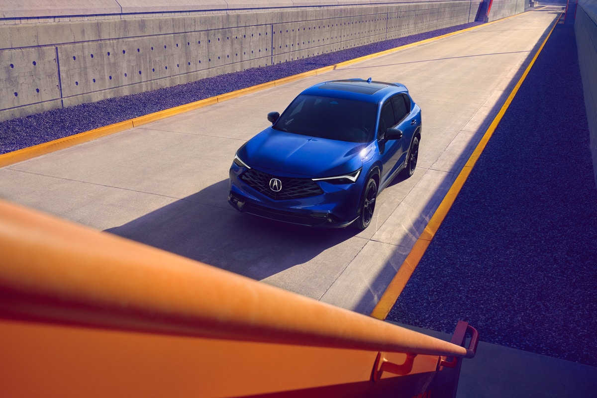 A%20blue%20new%20Acura%20SUV%20driving.jpg