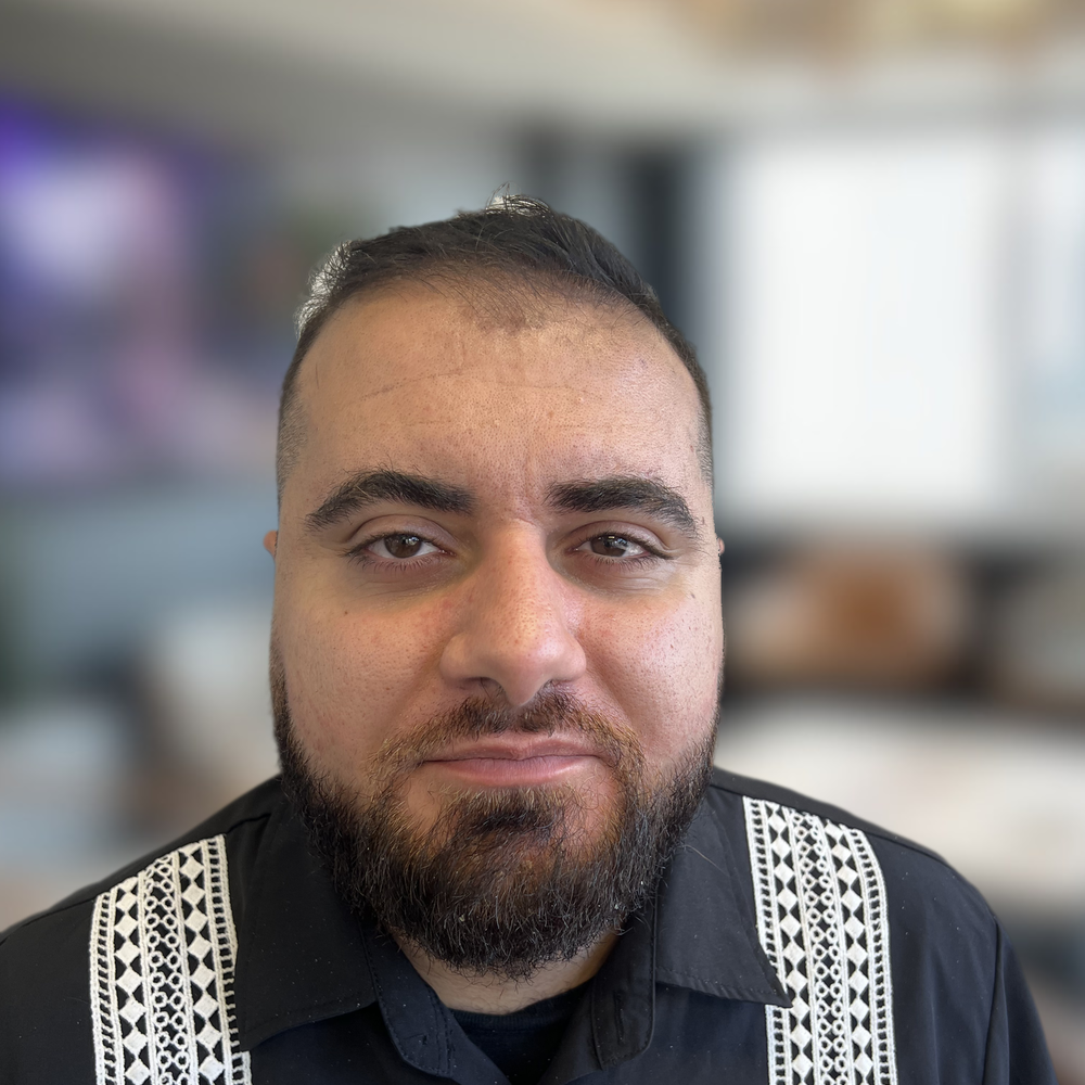 Staff member Alex Marogi from 7d92c3b290ae
