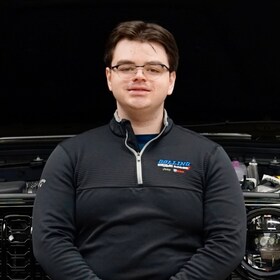 Staff member Ethan Gulu from 7d92c3b290ae