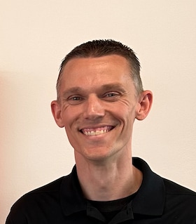 Staff member T.J. Berg from 1726150e2af4