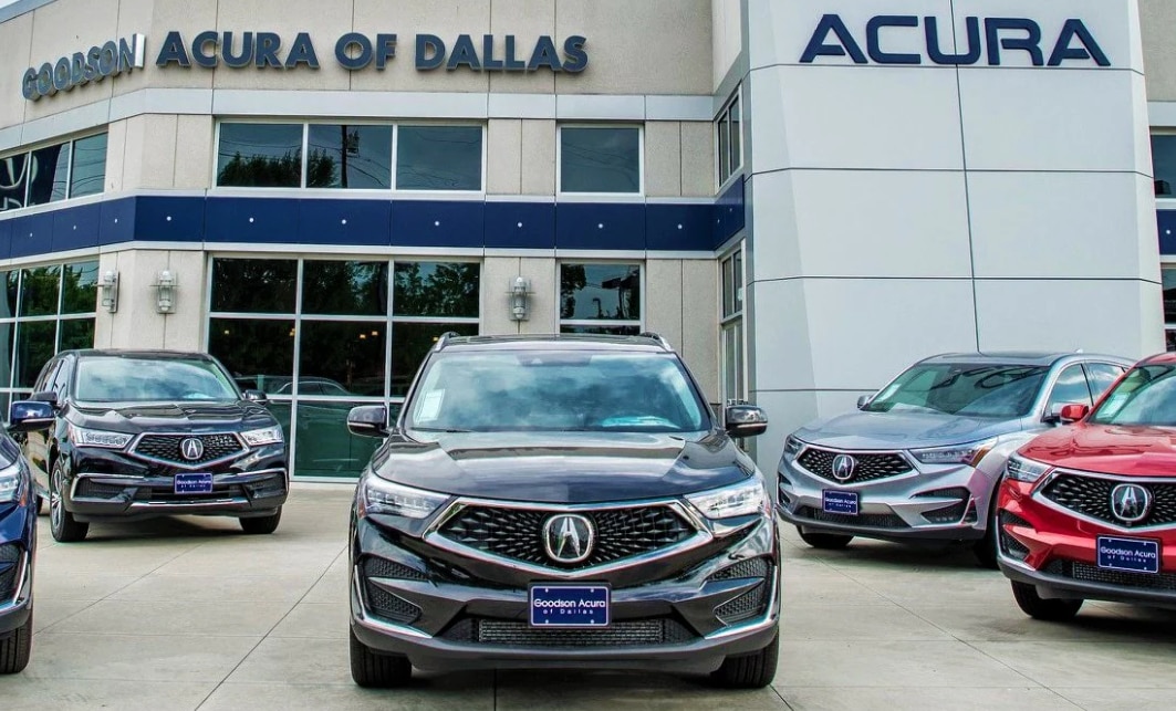 DefaultFront view of luxury Acura SUVs parked in front of Goodson Acura, a premier Dallas Acura dealership