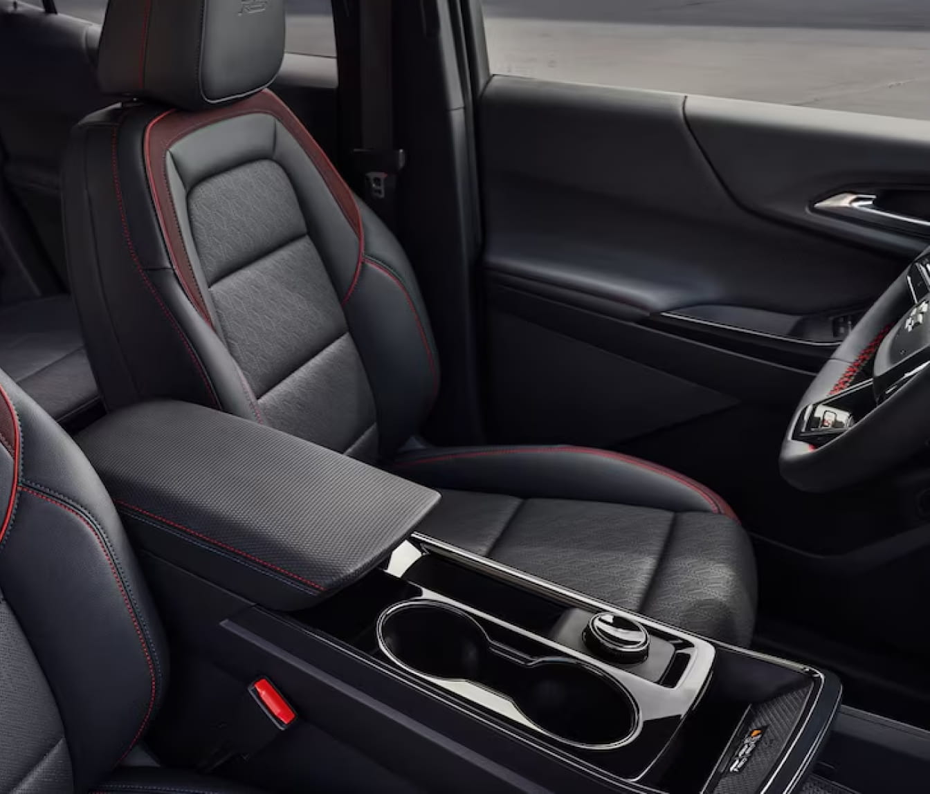 2026 Chevrolet Equinox interior with black leather seats featuring red stitching.